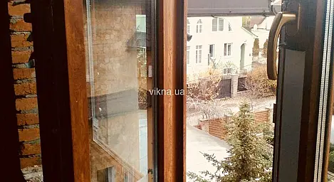 Вікна Rehau кольору «золотий дуб» в приватному будинку - головне фото